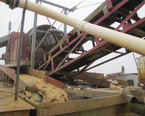 Gold being sieved from larger material at one of Glass Earth Gold's recovery units, pictured ...
