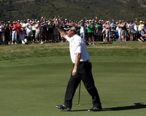 Richard Johnson celebrates his hole in one at the 15th (party hole) during the final round of the...