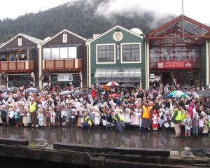 Hundreds gathered on Steamer Wharf and around Queenstown Bay to welcome  TSS Earnslaw to its home...