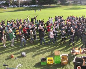 Hundreds of NZSki staff and unlucky seasonal workers performed a snow dance at the Queenstown Rec...