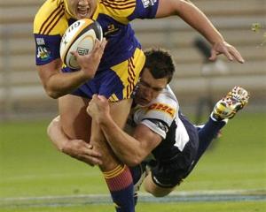 Impressive young fullback Israel Dagg is dragged down by Brumbies back Adam Ashley-Cooper at...