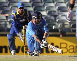 India's Sachin Tendulkar plays a shot off Sri Lanka's Tillakaratne Dilshan during their one-day...