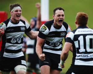 Israel Dagg (C) celebrates with Hawke's Bay teamates Ihaia West (R) and Brendon O'Connor after...