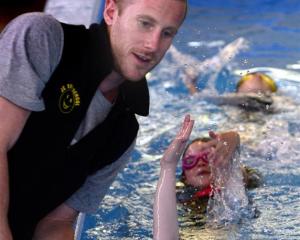 JC Swimming School instructor Kurt Crosland teaches Andersons Bay School pupils (from bottom)...