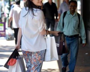 Jess Gleeson, of Dunedin fashion outlet Carlson, makes the most of George St yesterday, before a...