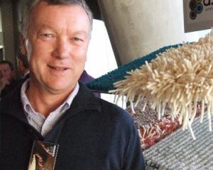 John Grainger with samples of the Ascend Rugs range during the New Zealand Merino Company's...