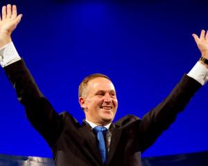 John Key celebrates retaining power after the general election in Auckland. REUTERS/Nigel Marple