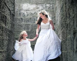 Kate Anderson and her flower girl at her January wedding. KELK PHOTOGRAPHY.