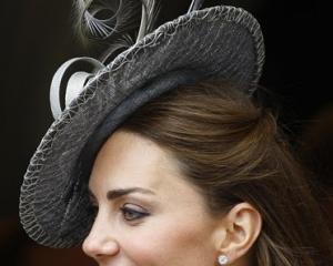 Kate, Duchess of Cambridge watches the procession pass at the Order of The Garter Service in...