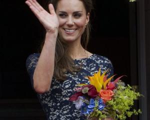 Kate, Duchess of Cambridge waves to the crowd at a ceremony at Rideau Hall in Ottawa, Ontario.  ...