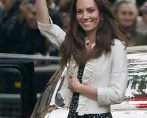 Kate Middleton waves to the crowds gathered outside the Goring Hotel in London yesterday ahead of...