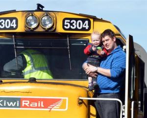 Keiran Harper and his son Oliver (20 months) aboard KiwiRail's exhibition express,  which visited...