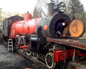 Kingston Flyer crew member George King works on the boiler of Ab 795. Photo supplied.