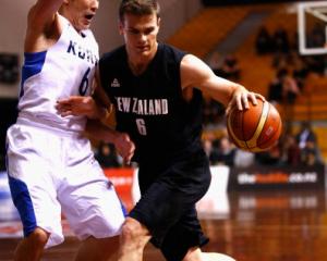 Kirk Penney takes the ball forward for the Tall Blacks against South Korea. (Photo by Phil Walter...
