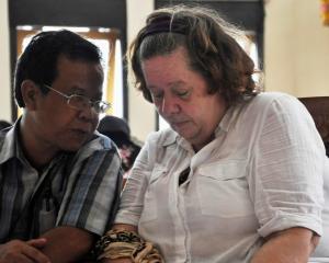 Lindsay Sandiford listens to her translator during her trial in Denpasar in Bali. REUTERS/Stringer
