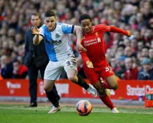 Liverpool's Raheem Sterling (R) contests the ball with Blackburn Rovers' Craig Conway. Reuters /...