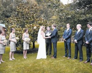 Lucinda Borrie and Chris Garside exchange vows at Grandview Gardens in Febraury. Photo by Kerry...