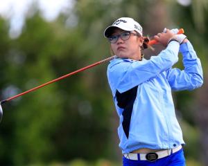 Lydia Ko follows her tee shot on the fourth hole. Photo Getty Images