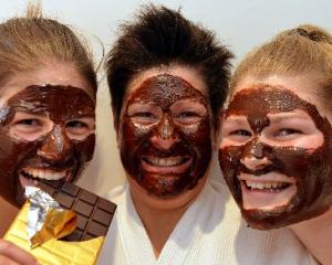 Lynette Johnstone (centre) and daughters Celine (left) and Jodie indulge in chocolate facials as...