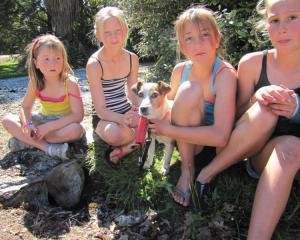 Macca is reunited with the Gibson sisters (from left) Holly (6), Alyssa (11) and Caitlin (10) and...