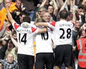 Manchester United's Wayne Rooney, centre, celebrates his second goal against West Ham United with...