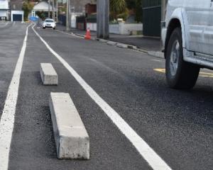 Many of the concrete kerb blocks were removed from Coughtrey St yesterday, with large chunks of...