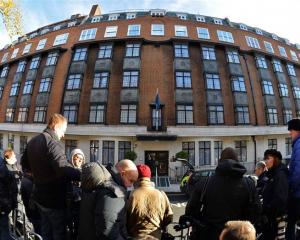 Media wait outside the King Edward VII hospital.  REUTERS/Toby Melville