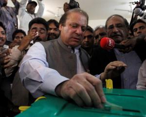 Nawaz Sharif, leader of the Pakistan Muslim League - Nawaz (PML-N) political party, casts his...