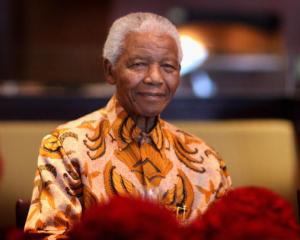 Nelson Mandela attends a lunch to benefit the Mandela Children's Foundation in Cape Town in this...