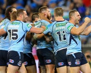 New South Wales players celebrate Josh Dugan's try against Queensland. Photo Getty