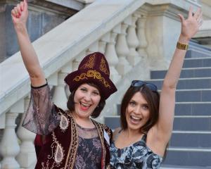 Newly-sworn New Zealand citizen Alevtina Redden (30), left, of Kazakstan, with friend Genia...