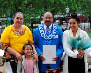Newly sworn New Zealand citizen Rev Sione Pule, of Tonga, with wife Ngaluafe and two of his...
