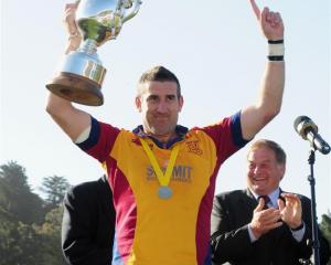 North Otago captain Luke Herden holds the Meads Cup aloft after his team beat Wanganui in the...
