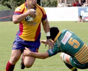 North Otago No 8 Tevita Fifita charges past Mid Canterbury lock Dan Dwyer during the Meads Cup...