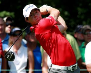 Northern Ireland golfer Rory McIlroy hits a drive on the second tee during round one of the BMW...