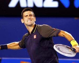 Novak Djokovic of Serbia celebrates defeating David Ferrer of Spain in their men's singles semi...