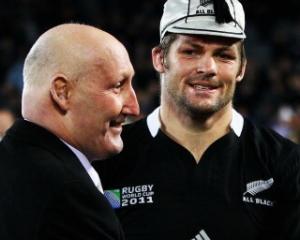 NZRU Chairman Jock Hobbs presents All Black captain Richie McCaw with his 100th test cap after...