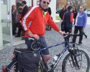Omakau resident Stephen Wood , a member of the Cycling Advocates Network, arrives on his bike for...