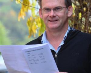 Otago Adventure Development counsellor Scott Blair holds a leaflet on the health effects of...