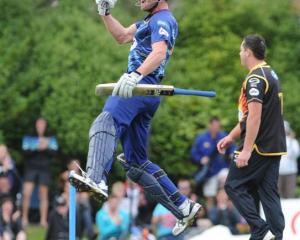 Otago all-rounder Ian Butler leaps into the air after hitting the winning runs.
