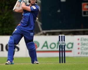Otago batsman Michael Bracewell plays through the offside during his inninngs of 60 runs off 49...