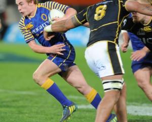 Otago first five Hayden Parker sets off upfield against Wellington during their ITM Cup match at...
