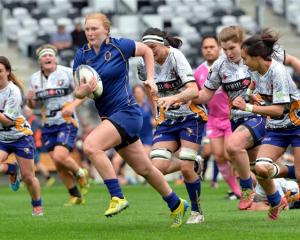 Otago Spirit centre Greer Muir is chased by a third of the Bay of Plenty side at Forsyth Barr...