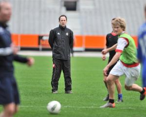 Otago United coach Richard Murray leads his team in training at Forsyth Barr Stadium. Photo by...