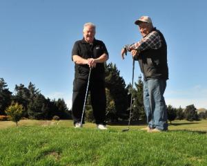 Otakou Golf Course president Alex MacGillivray and club member Kevin Charles stand on a swale of...