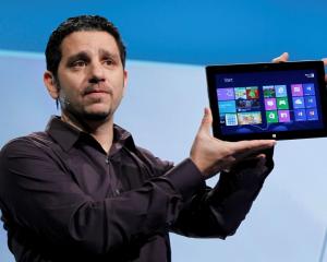 Panos Panay, the general manager of the team behind the Microsoft Surface holds up the new...