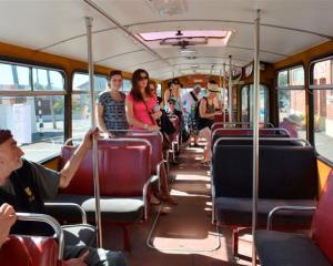 Passengers enjoy riding on a restored bus in Dunedin yesterday. Photo by Gerard O'Brien.