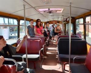Passengers enjoy riding on a restored bus in Dunedin yesterday. Photo by Gerard O'Brien.