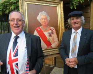 Peter Doyle (left) and Thomas Brown with a portrait of the Queen, painted by  Brown in honour of...