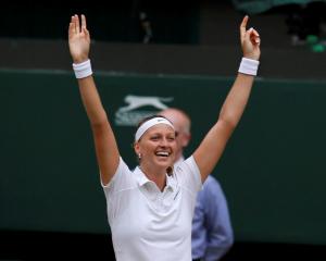 Petra Kvitova celebrates her victory over Eugenie Bouchard. REUTERS/Suzanne Plunkett
